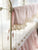 Scalloped Crib Rail Cover in Baby Pink and Ivory